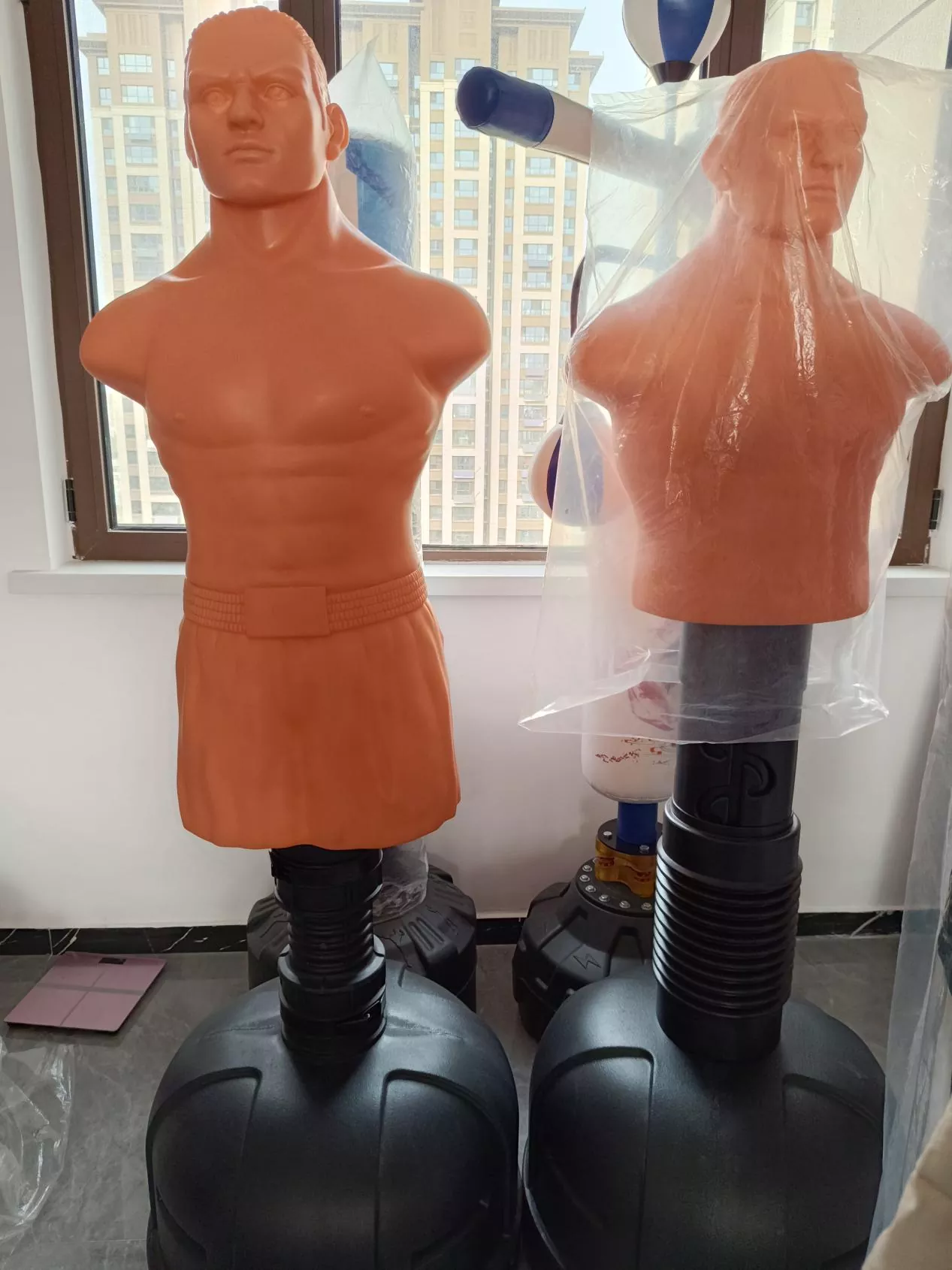 Human-shaped boxing dummy with realistic head, torso and limb proportions for combat training